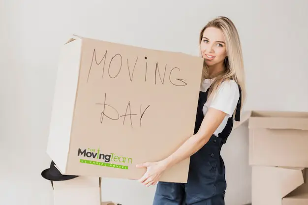 Organized moving boxes labeled 'Keep' and 'Donate', part of the decluttering process for moving house in Auckland.