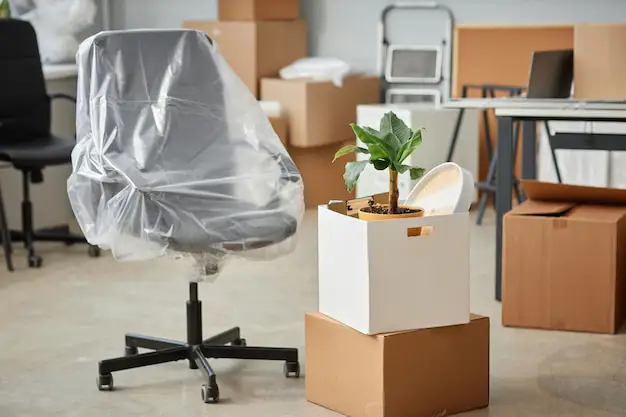 A modern Auckland office prepared for an efficient relocation by The Moving Team, with neatly packed boxes.