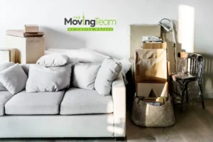 Alt Text: Person planning the budget for furniture moving cost in Auckland by measuring a sofa.