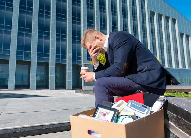 A professional mover carefully placing a computer server into a padded, anti-static crate during an IT relocation in Auckland.