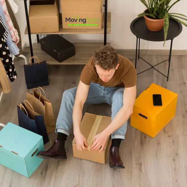 Alt Text: Business manager reviewing a quote and budgeting for an office move cost in Auckland.