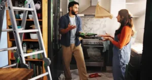 How to Pack Kitchen for Moving? A moving box with fragile kitchen dishes packed vertically with protective paper, following professional packing tips.