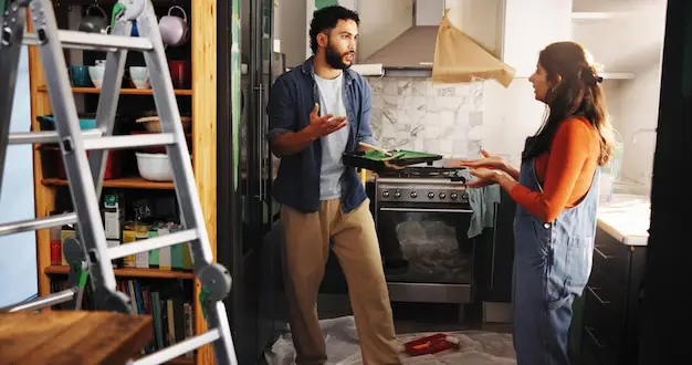 How to Pack Kitchen for Moving? A moving box with fragile kitchen dishes packed vertically with protective paper, following professional packing tips.