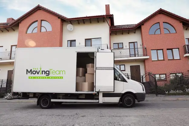 A sofa perfectly placed in a sunlit new living room after a successful move by our Auckland furniture movers.