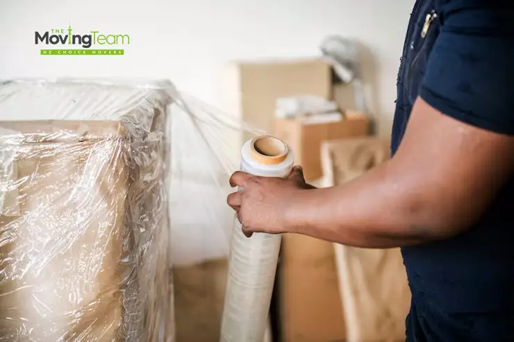 A fully packed living room with neatly stacked and labeled boxes, showing the result of our comprehensive house packing services in Auckland.