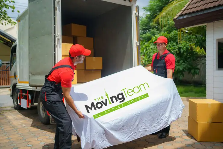 The Moving Team truck loading furniture at a spacious family home in Manukau, movers South Auckland.